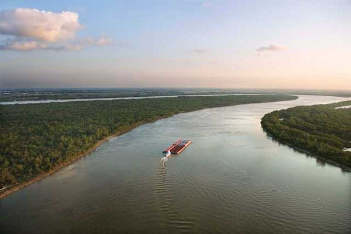 A barge making its way down a river