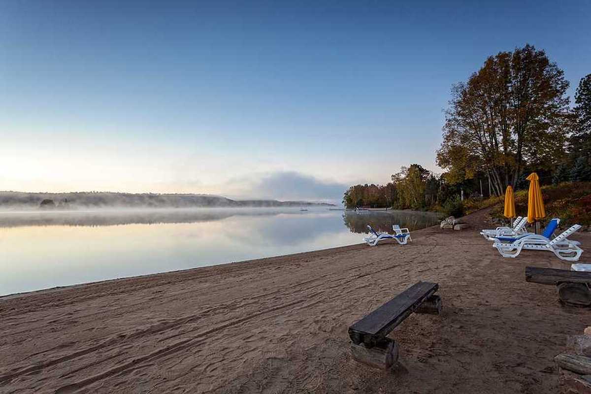 A beach on a misty lake