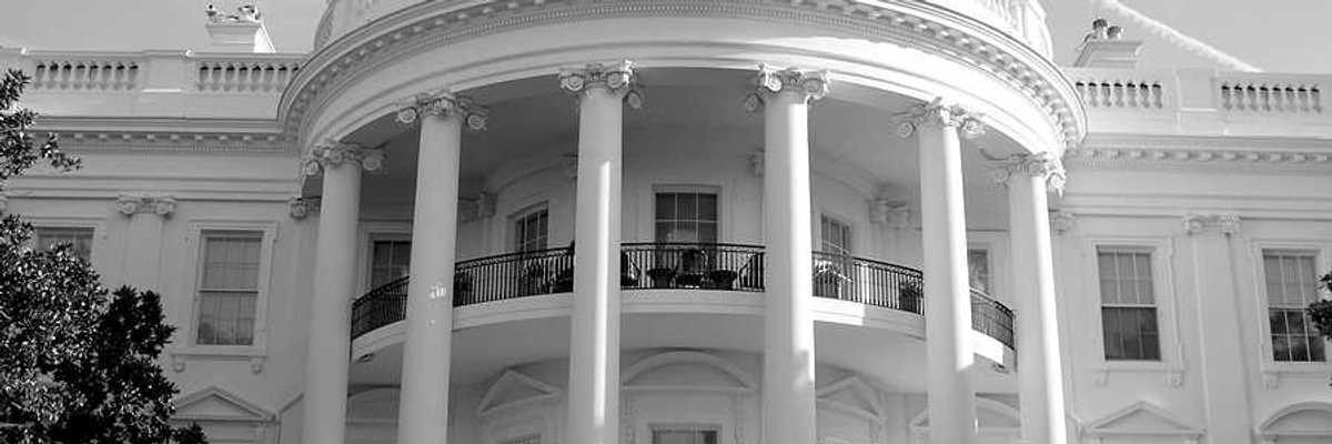 A black and white photo of the front of the White House in Washington, DC