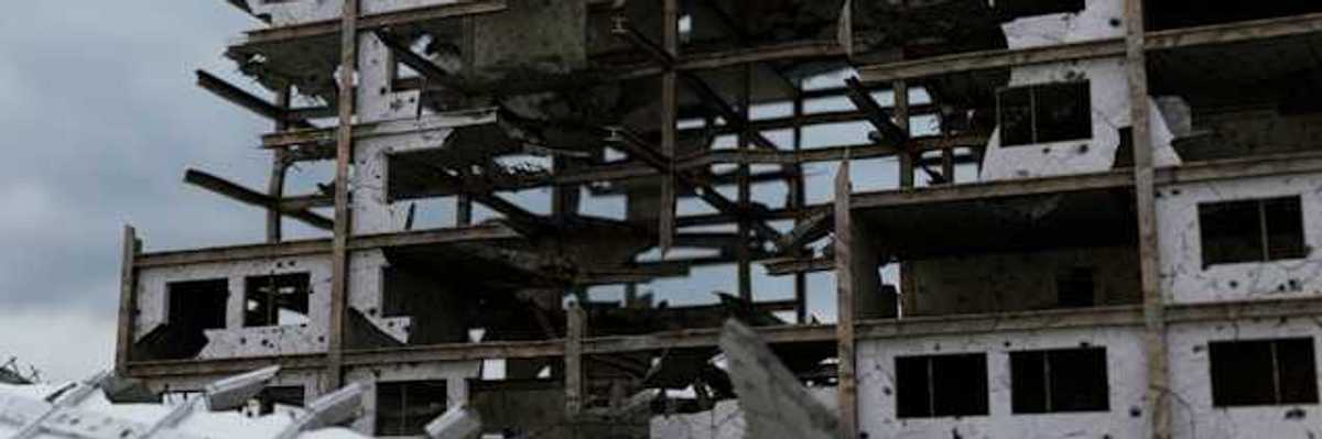 A bombed building against a grey sky