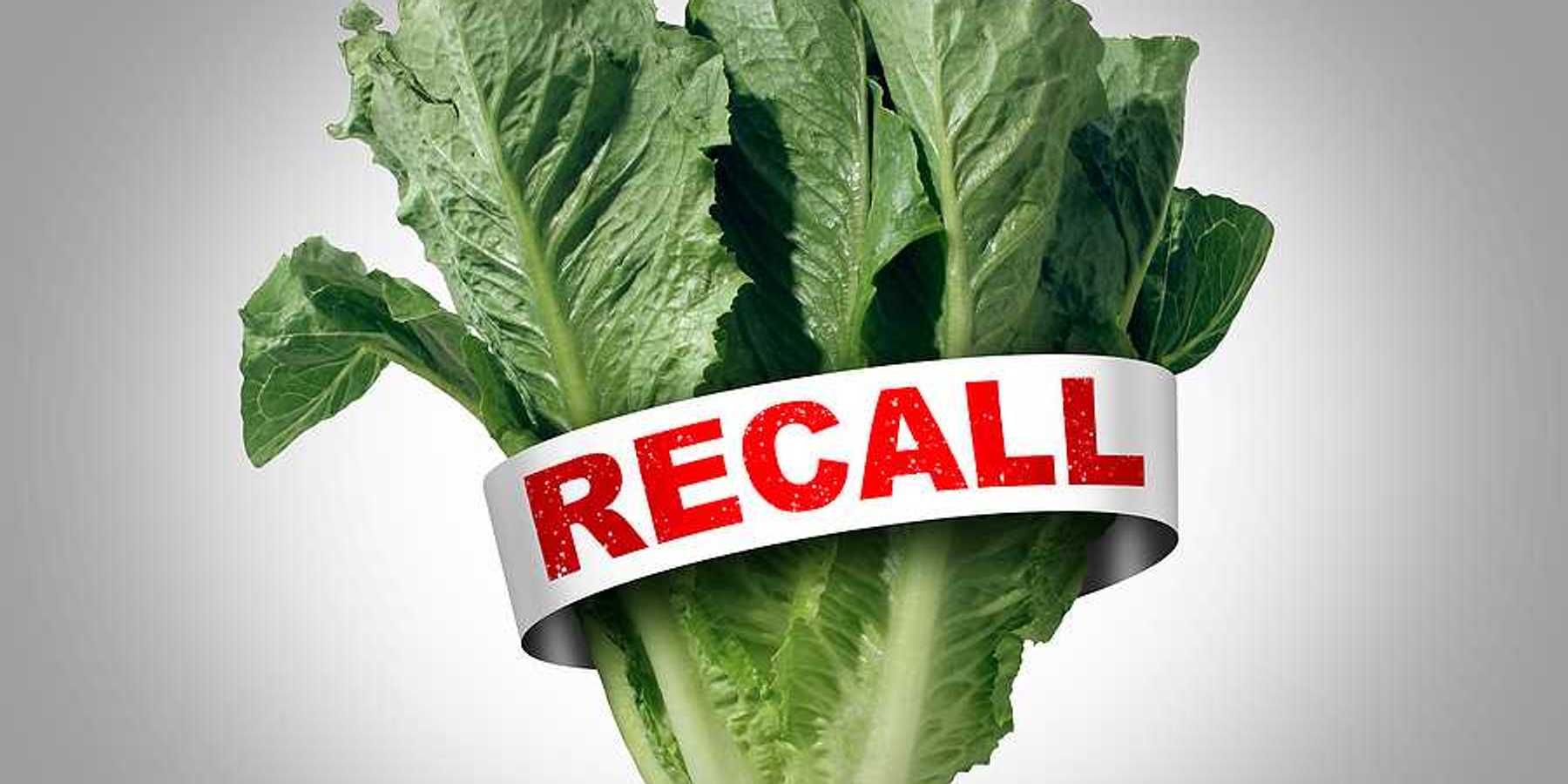 A bunch of lettuce with a tag with the word RECALL in red font