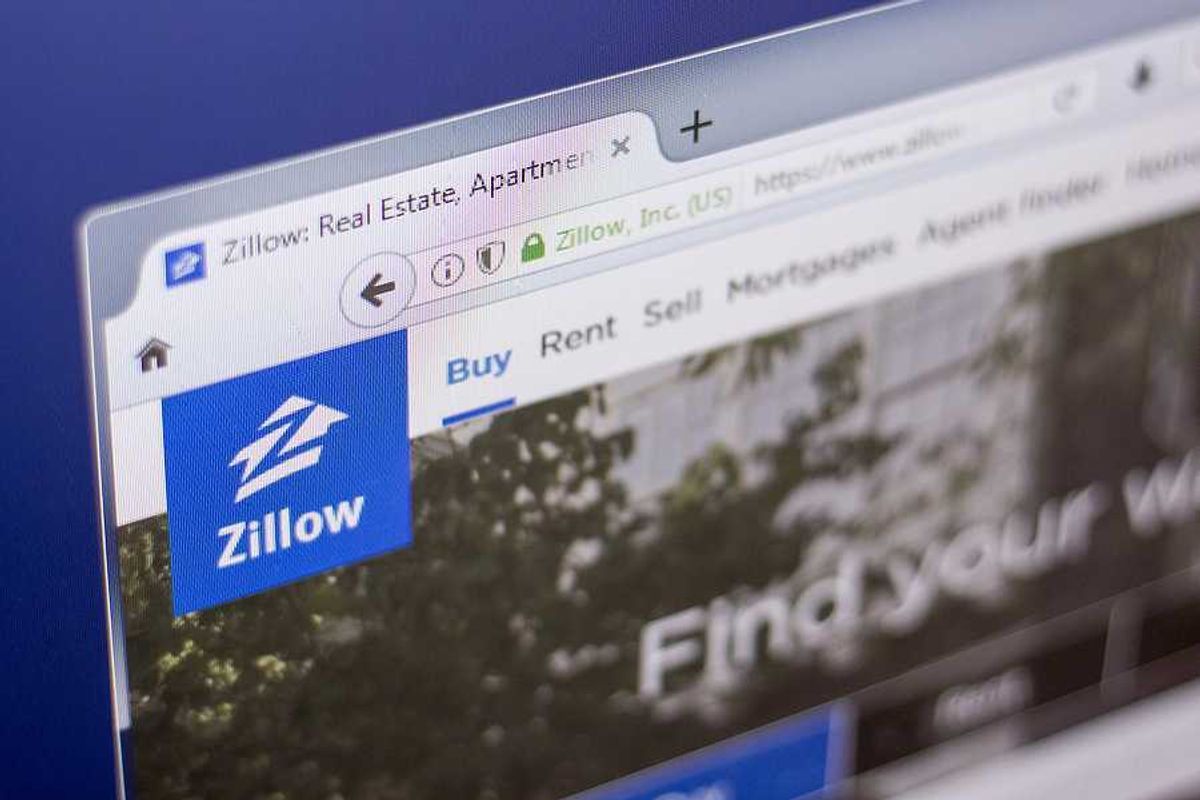 A closeup of the Zillow logo on a website