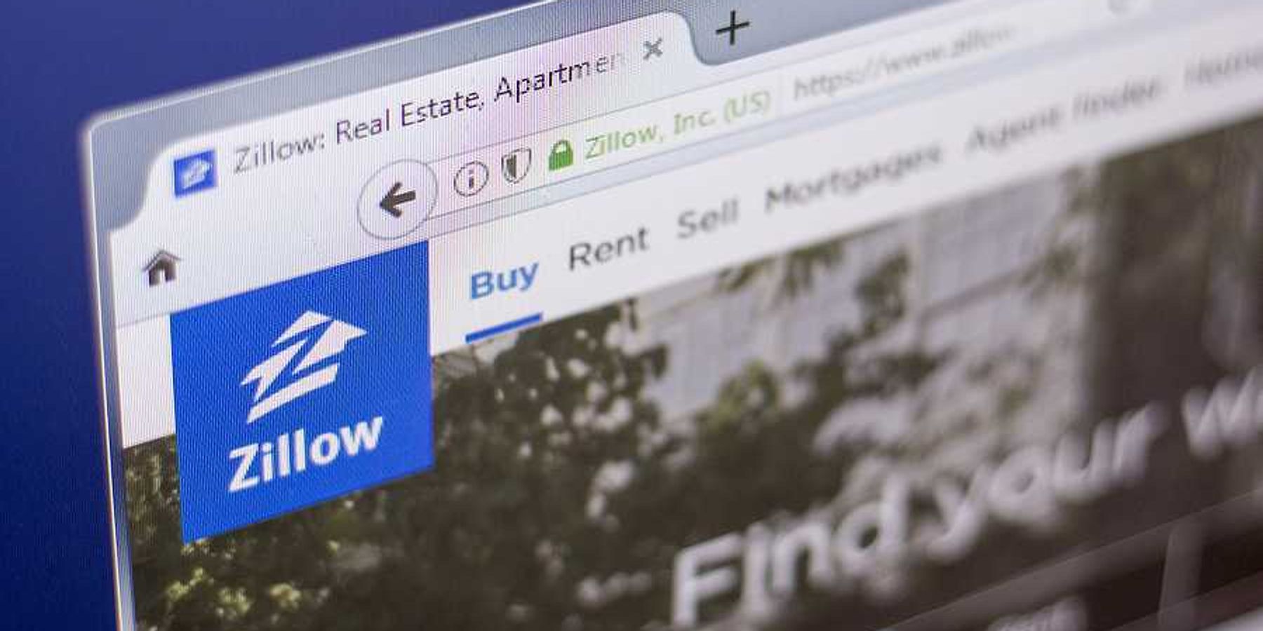 A closeup of the Zillow logo on a website
