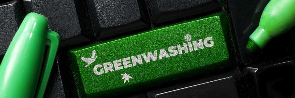 A computer keyboard with a green button called Greenwashing