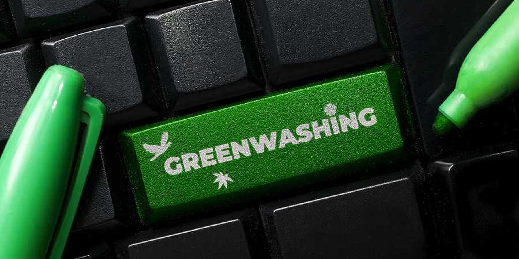 A computer keyboard with a green button called Greenwashing