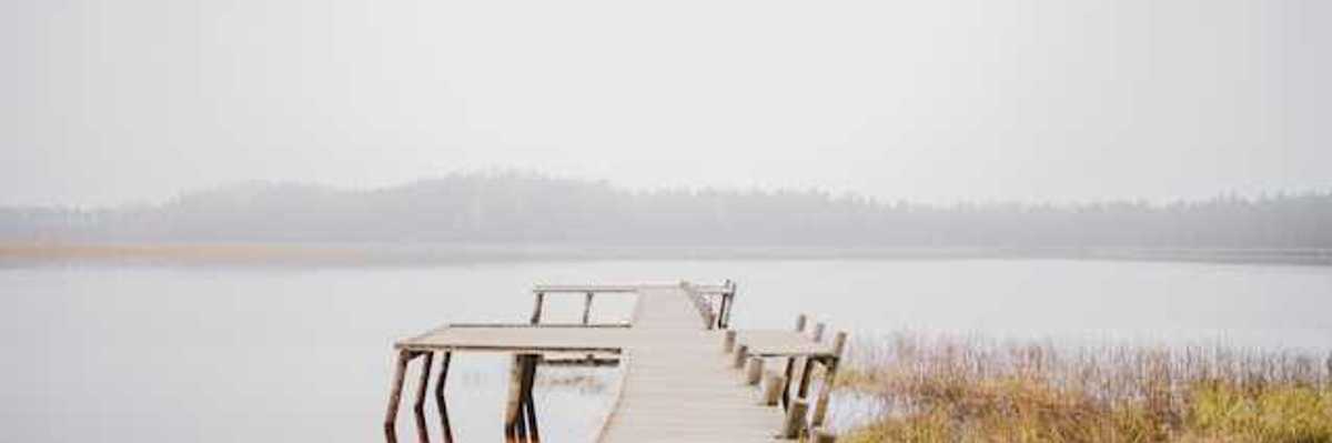 A dock stretching into a body of water