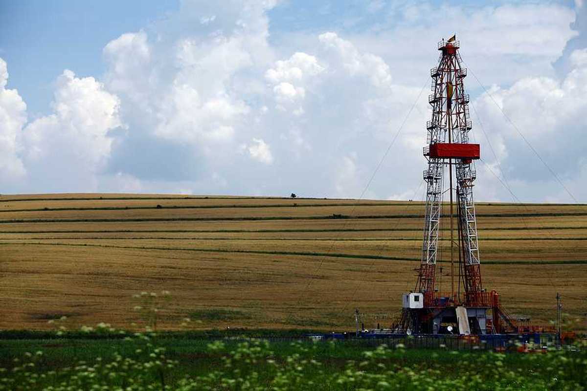 A fracking well next to a farm field