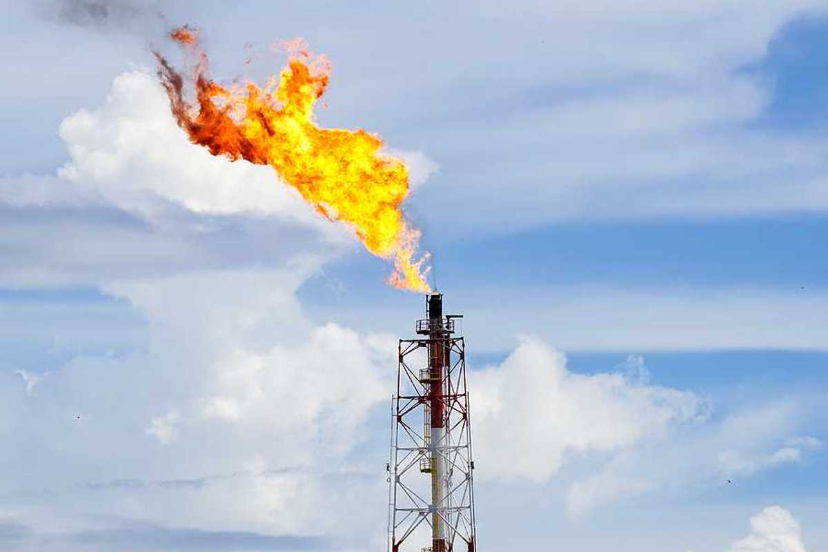 A gas flare at an oil refinery