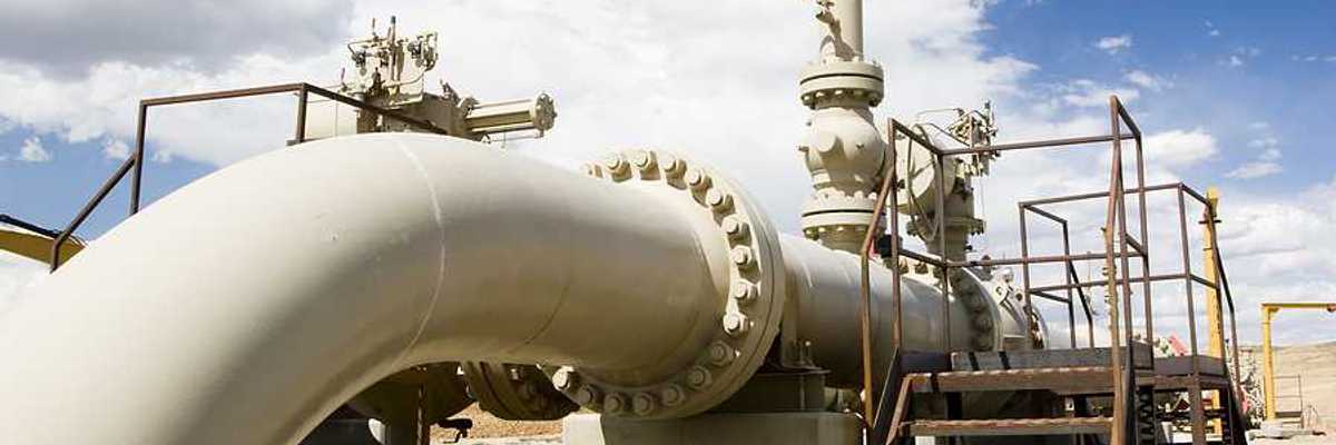A gas pipeline stretching across a desert landscape