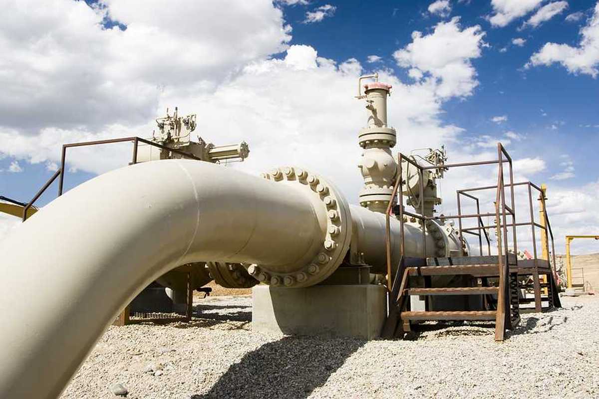 A gas pipeline stretching across a desert landscape