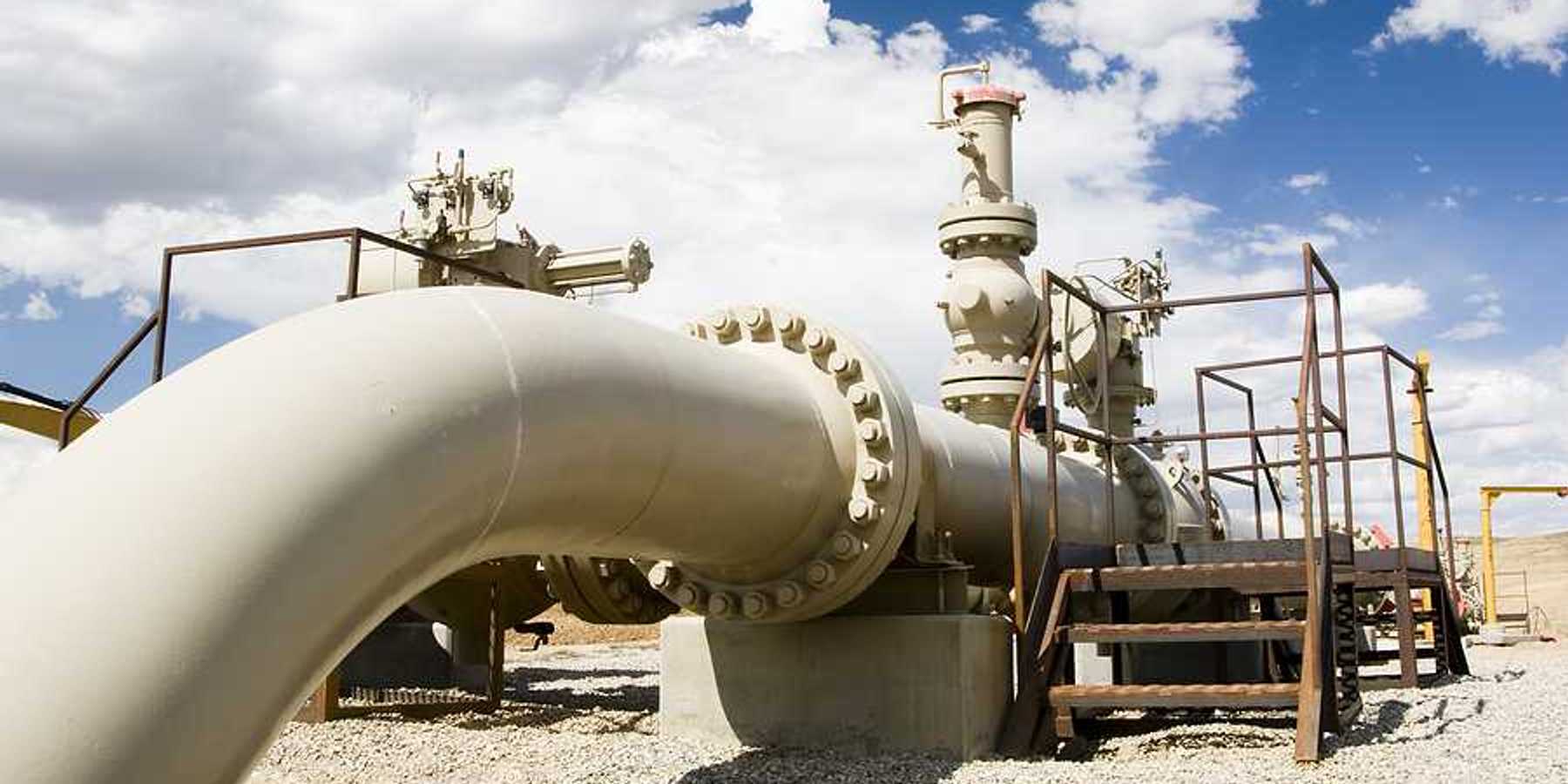 A gas pipeline stretching across a desert landscape