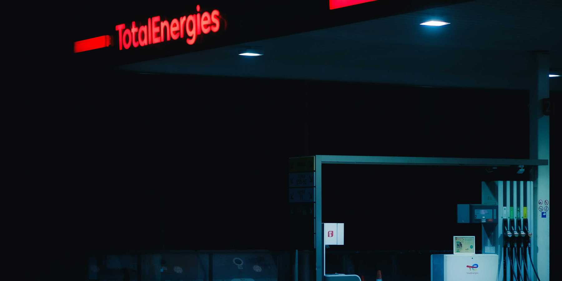 a gas station at night.