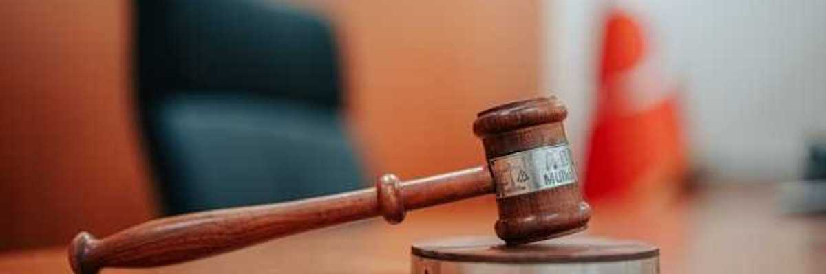 A gavel sitting on a judge's desk