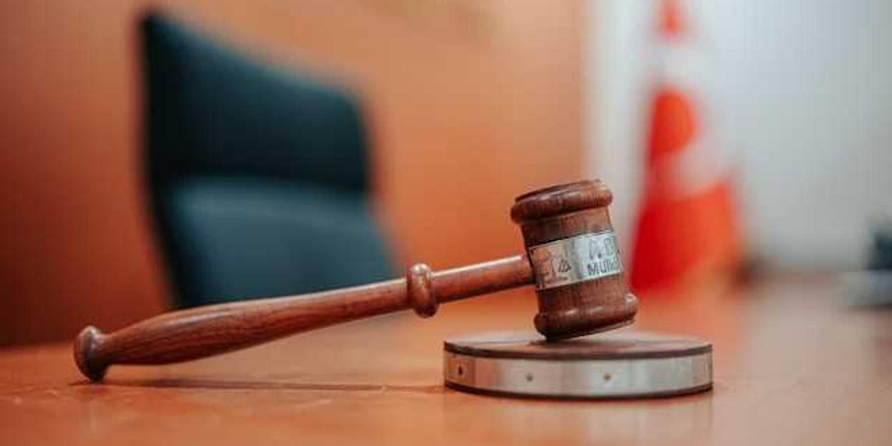 A gavel sitting on a judge's desk
