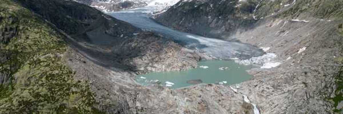 A glacial lake surrounded by snow capped mountains