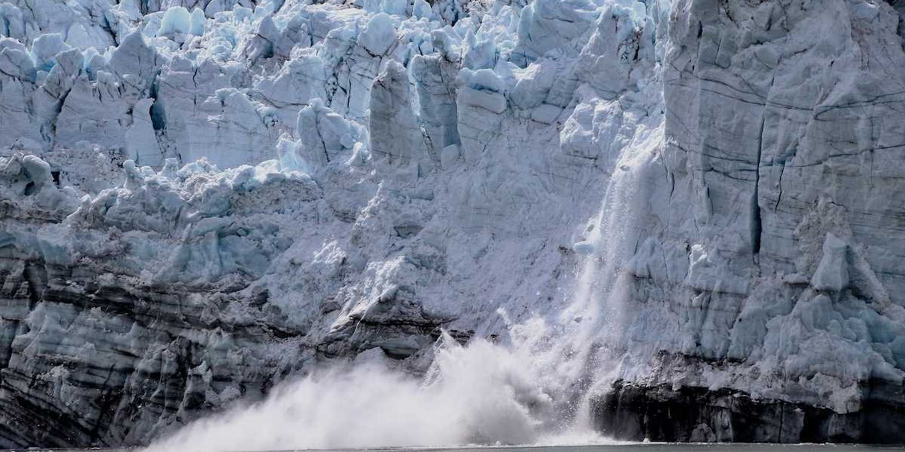 A glacier calving into sea
