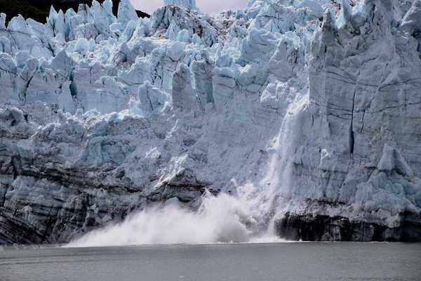 A glacier calving into sea
