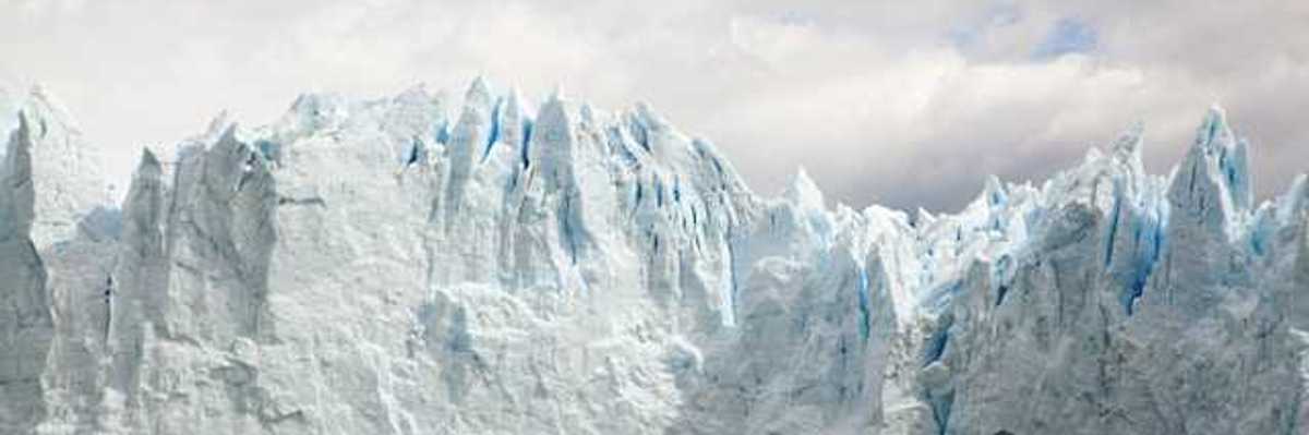 A glacier looming over a body of water