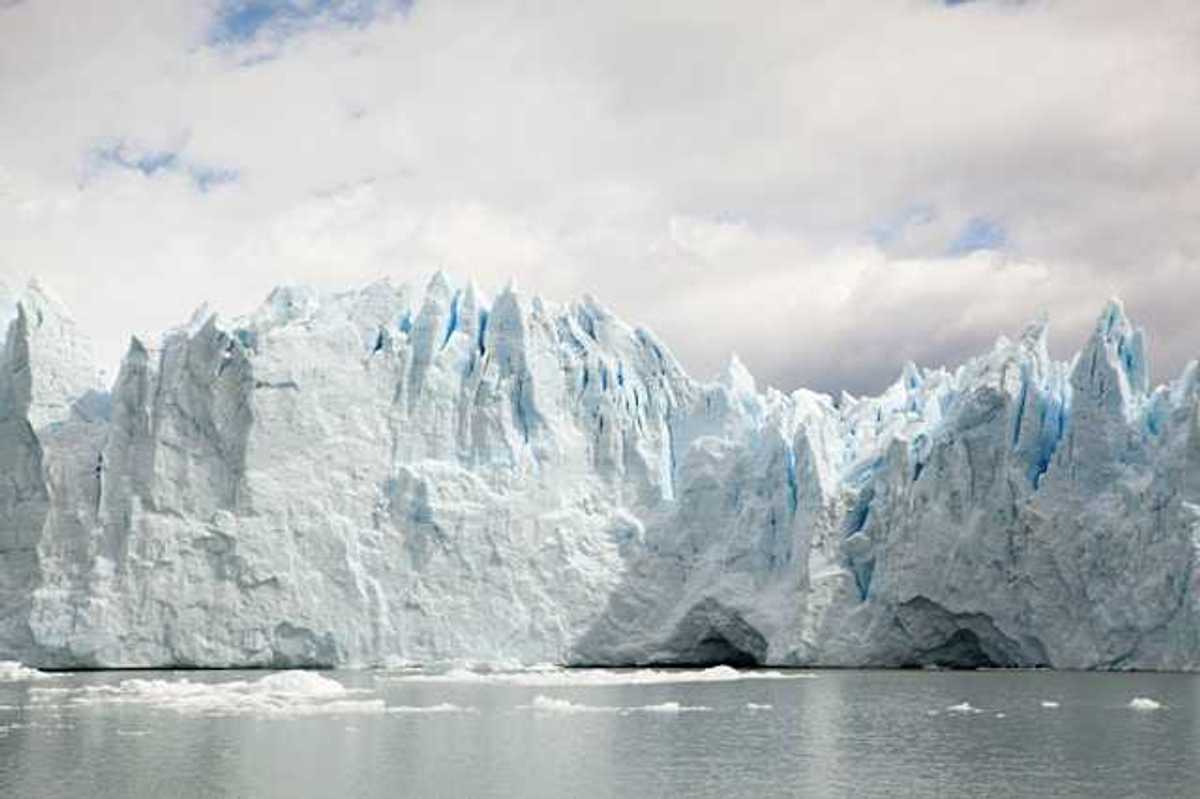 A glacier looming over a body of water