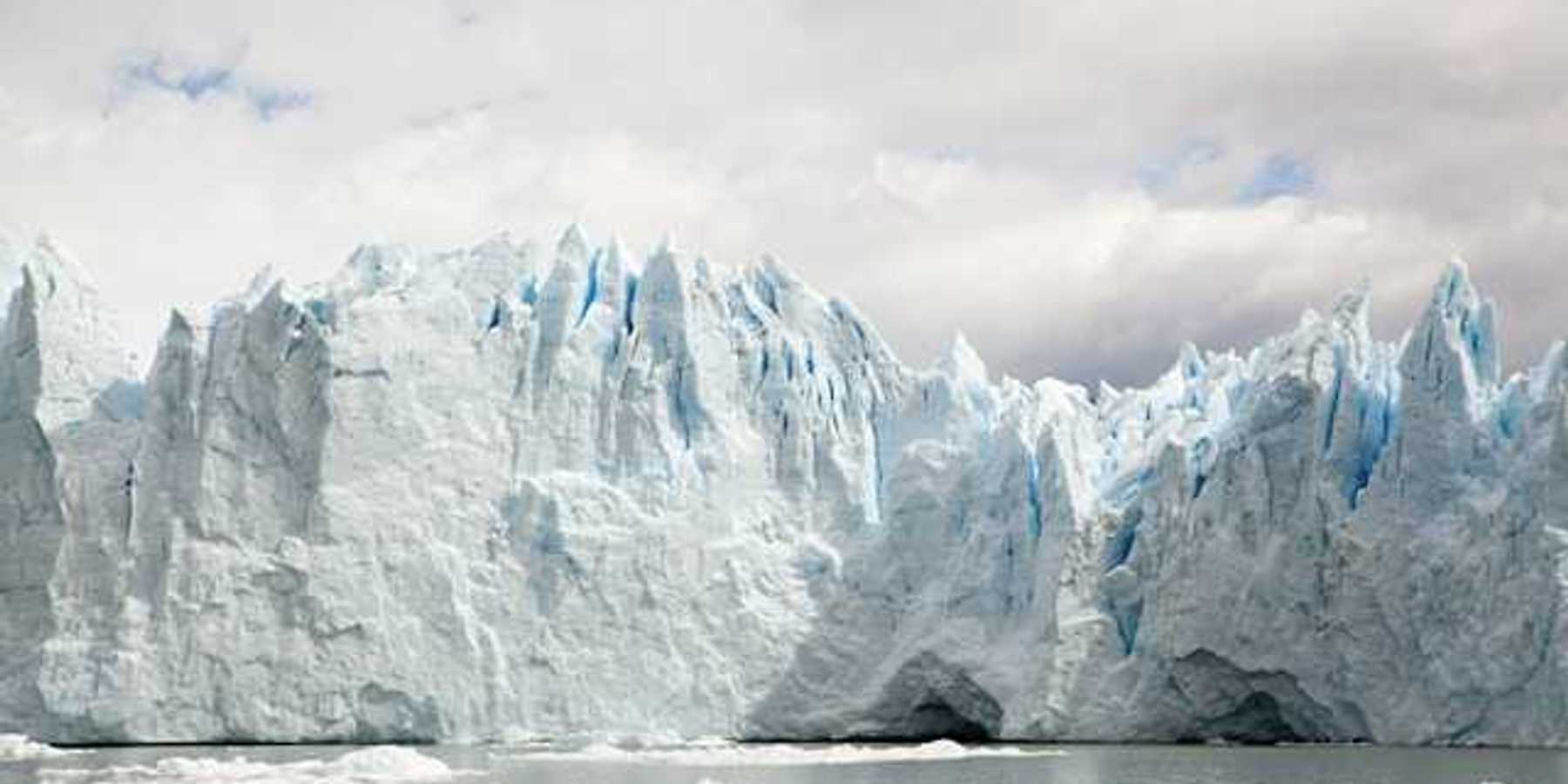 A glacier looming over a body of water