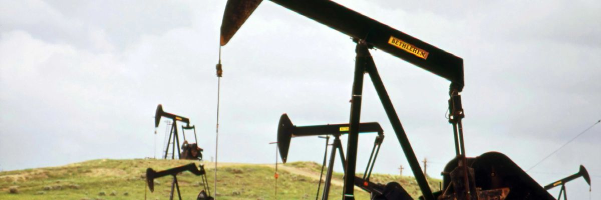 a group of oil pumps sitting on top of a field