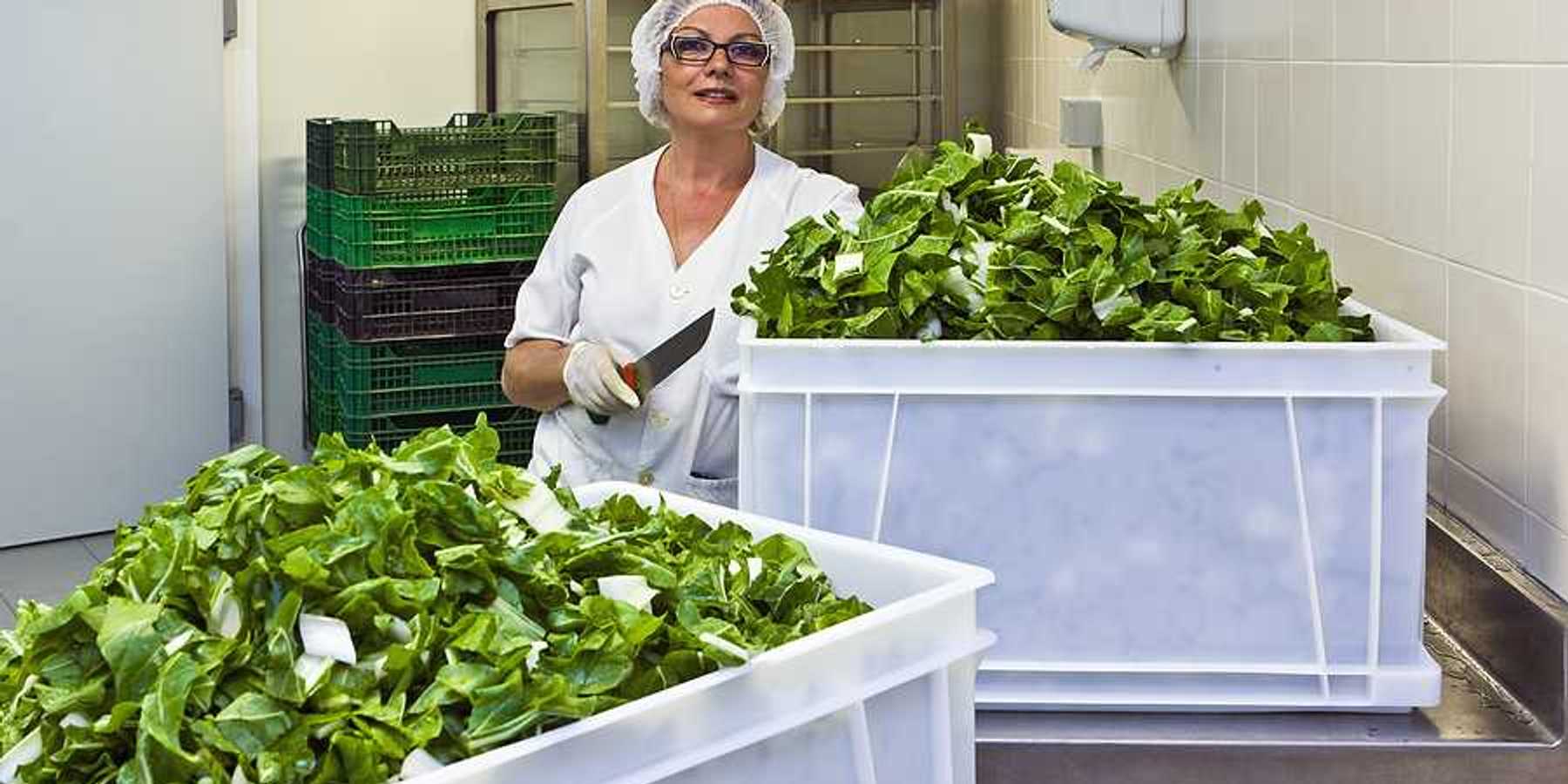 A hospital worker in a cafeteria kitchen