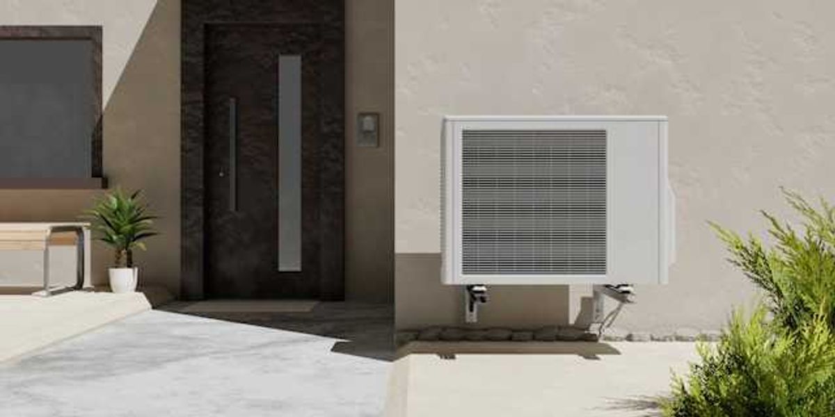 A house with a heat pump installed on the side of it