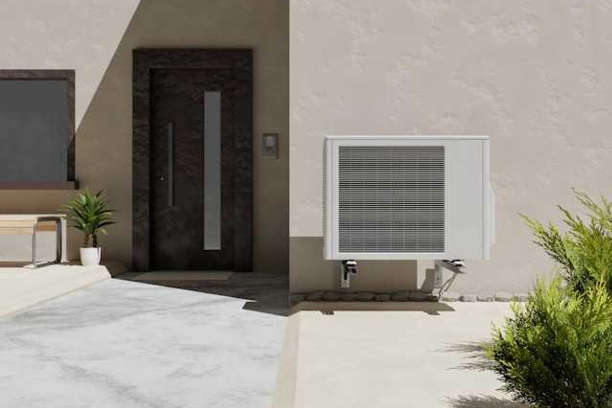 A house with a heat pump installed on the side of it