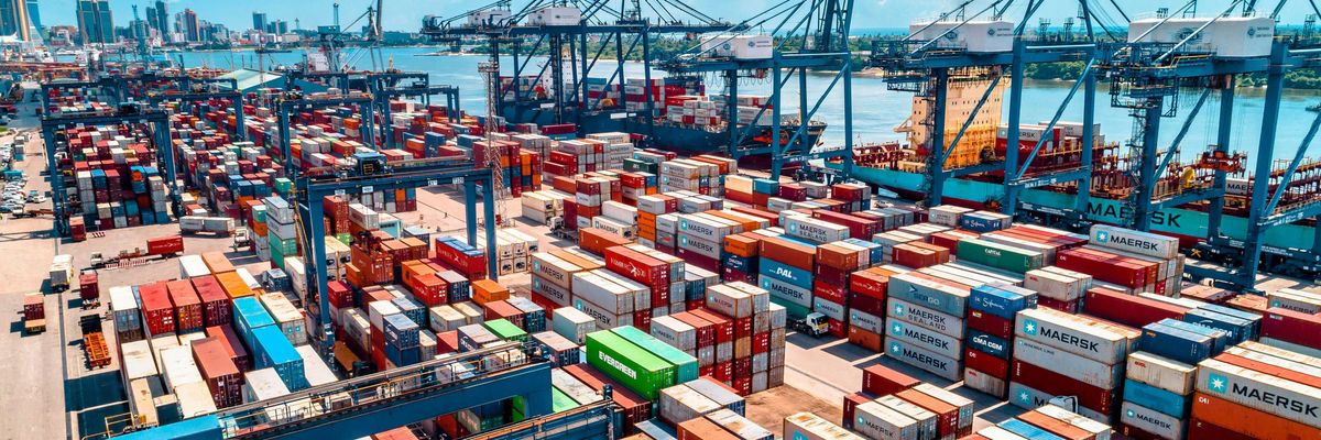 a large amount of containers are stacked on top of each other.