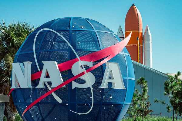 A large blue globe with the letters NASA on it