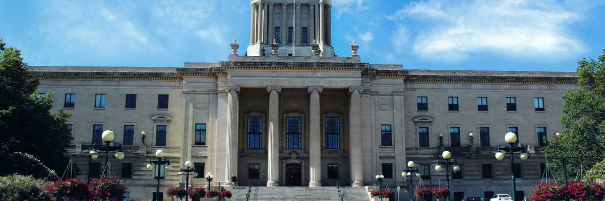 a large government building with a clock tower on top of it