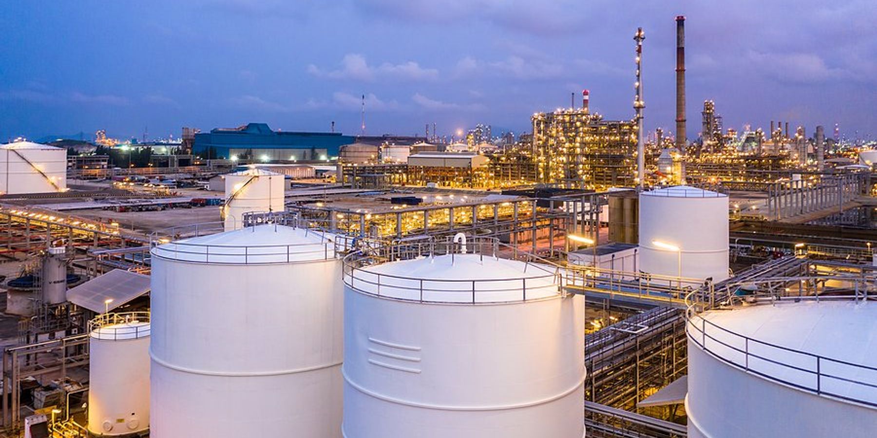 A liquid natural gas facility with storage silos.