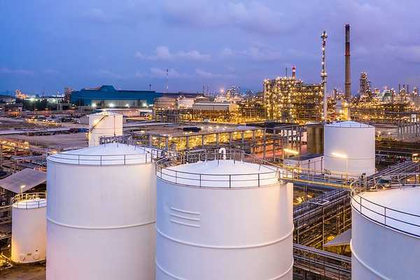 A liquid natural gas facility with storage silos.