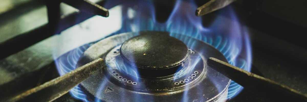A lit gas stove burner.