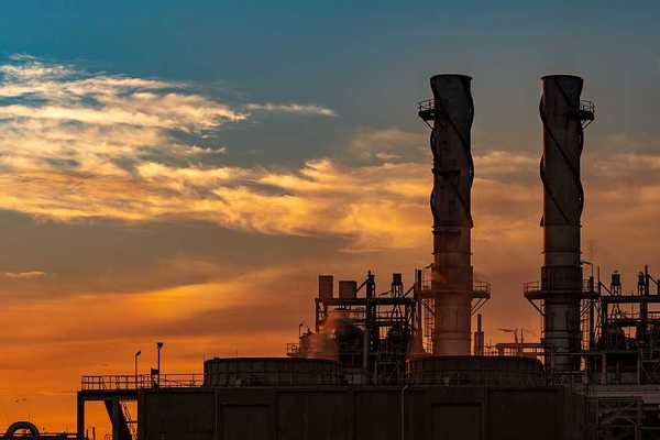 A natural gas power plant at sunset