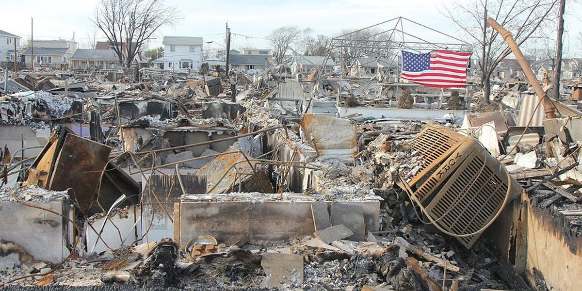 A neighborhood lies in charred rubble after a fire burned it.