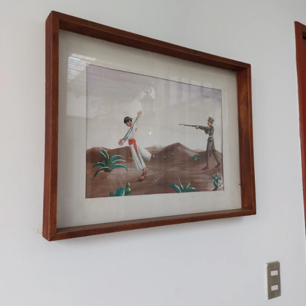 A painting in the offices of the nonprofit Tskini portrays the systematic murder of the Nahua at the beginning of the 20th century.