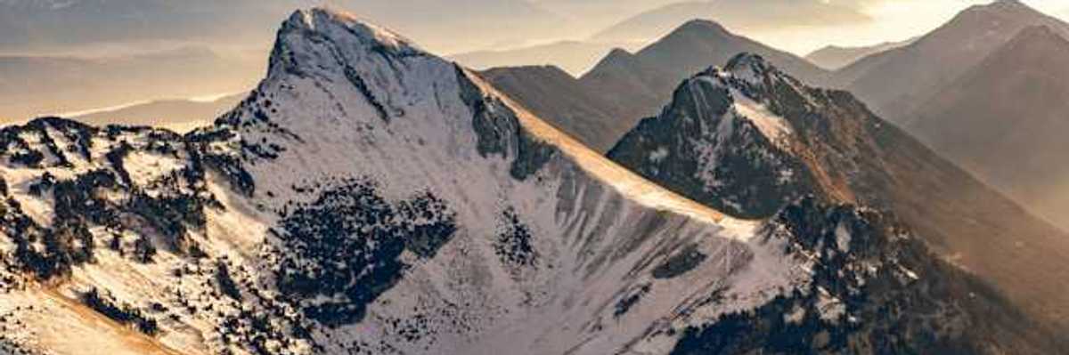A photo of snow-capped French alps during the golden hour