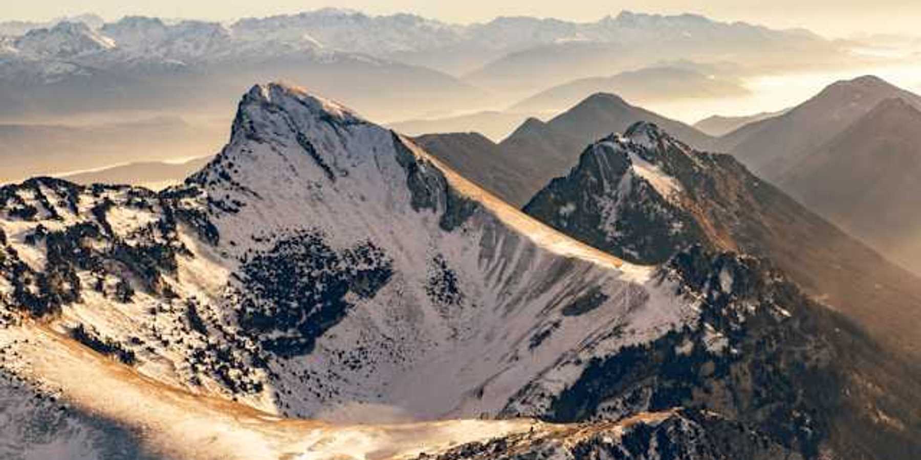 A photo of snow-capped French alps during the golden hour