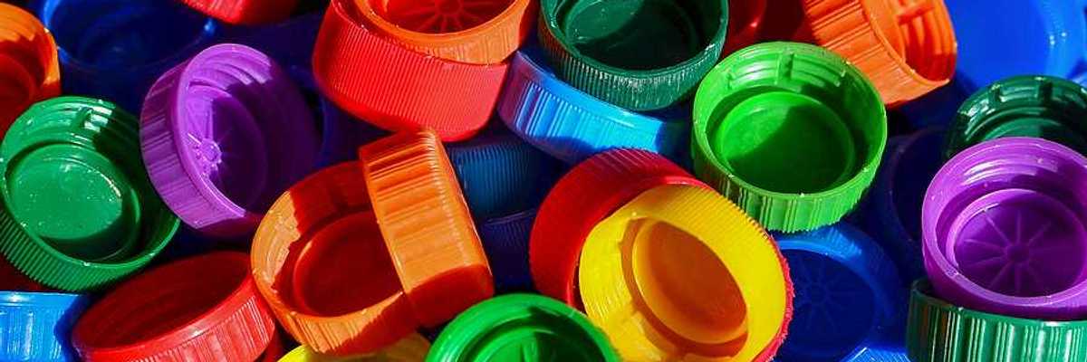 A pile of multicolored plastic bottle caps