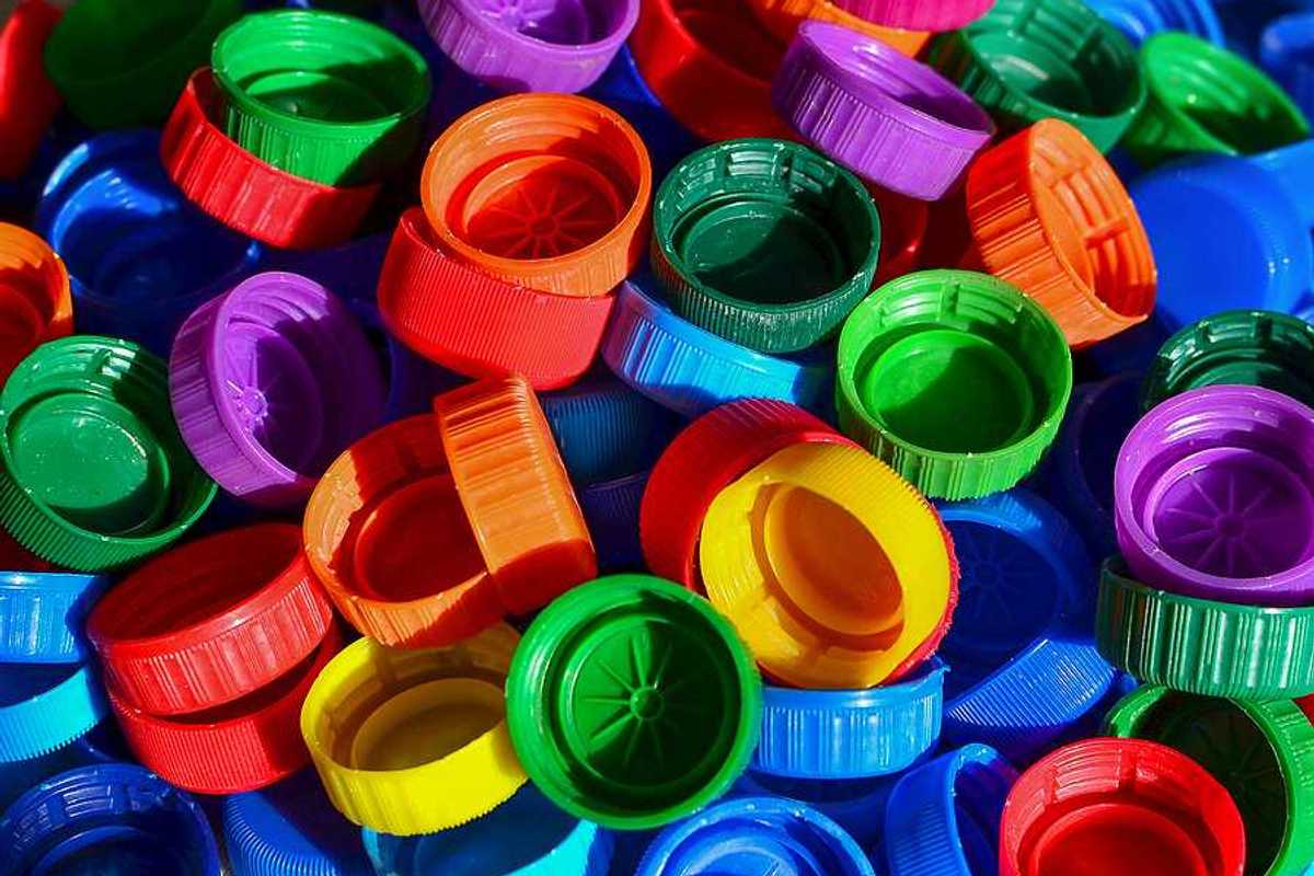 A pile of multicolored plastic bottle caps