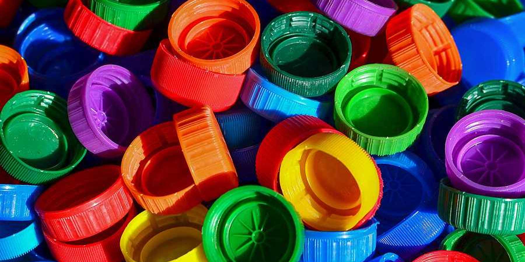 A pile of multicolored plastic bottle caps