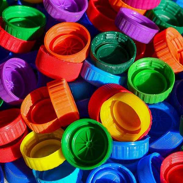 A pile of multicolored plastic bottle caps