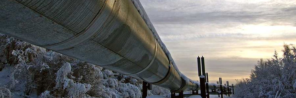 A pipeline stretching across a snowy landscape
