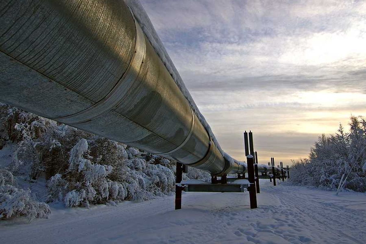 A pipeline stretching across a snowy landscape