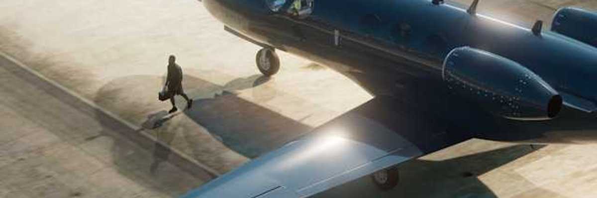 A private plane painted black sitting on the tarmac