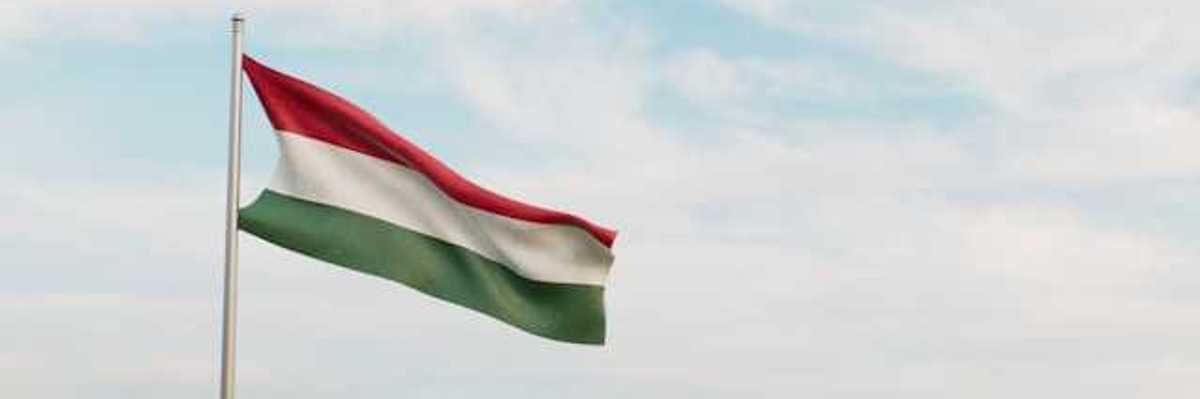 A red, white and green Hungarian flag waving in the wind