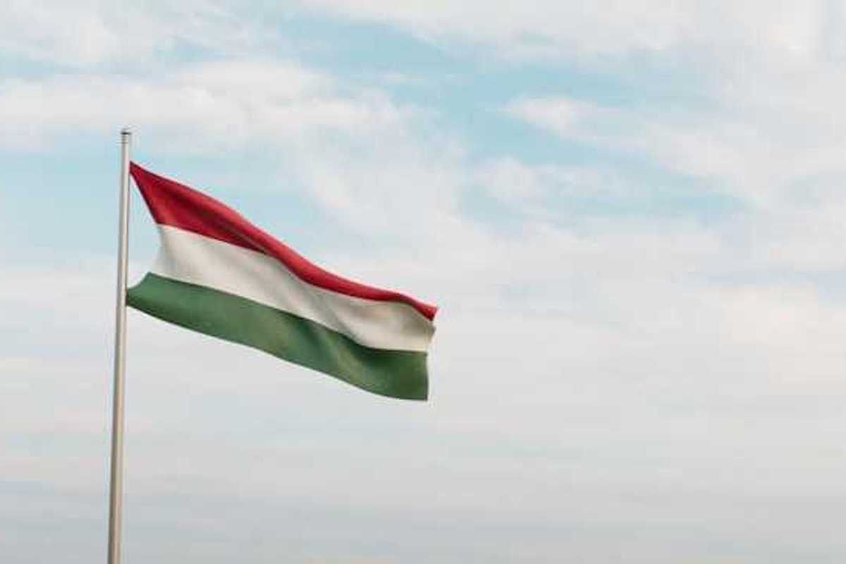 A red, white and green Hungarian flag waving in the wind