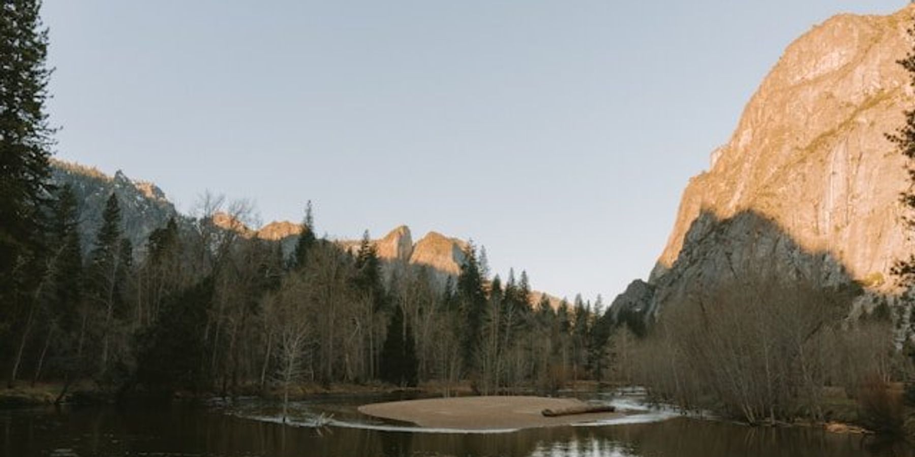 A river running between rocky hills.