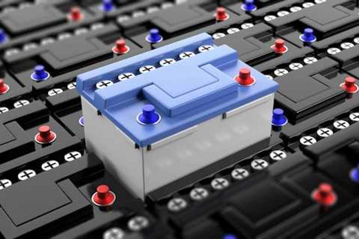 A row of black batteries with a blue battery rising in the center